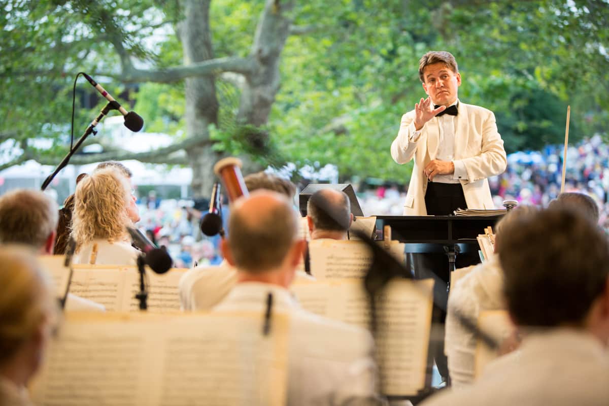 Conductor Keith Lockhart leads the Boston Pops Esplanade Orchestra at the 2015 Citizens Bank Pops by the Sea Concert, during his 20th Anniversary year as Maestro