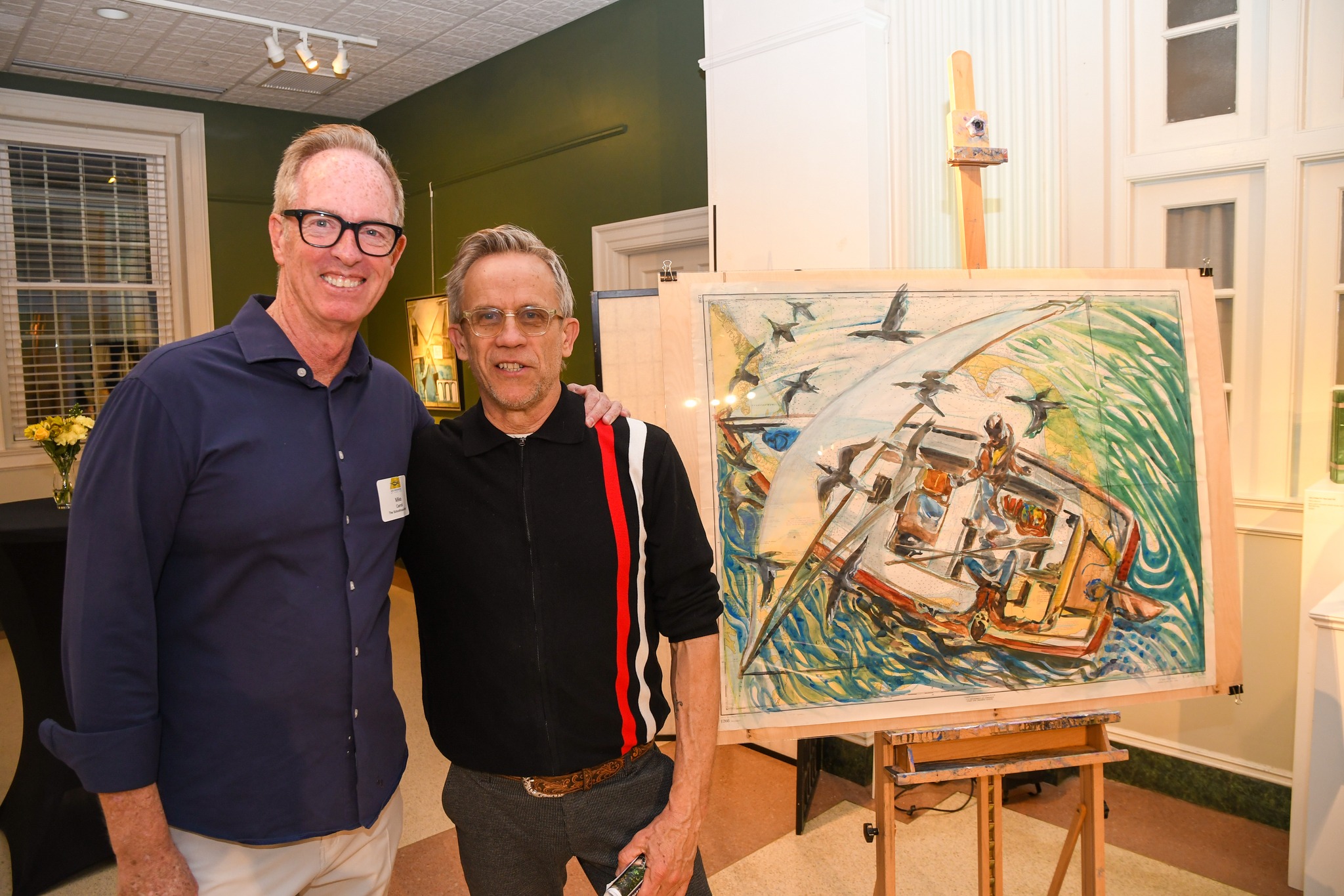 Mike Carroll and Mark Adams next to Mark's painting, Cormorants on the Wind/Cape Cod Bay.