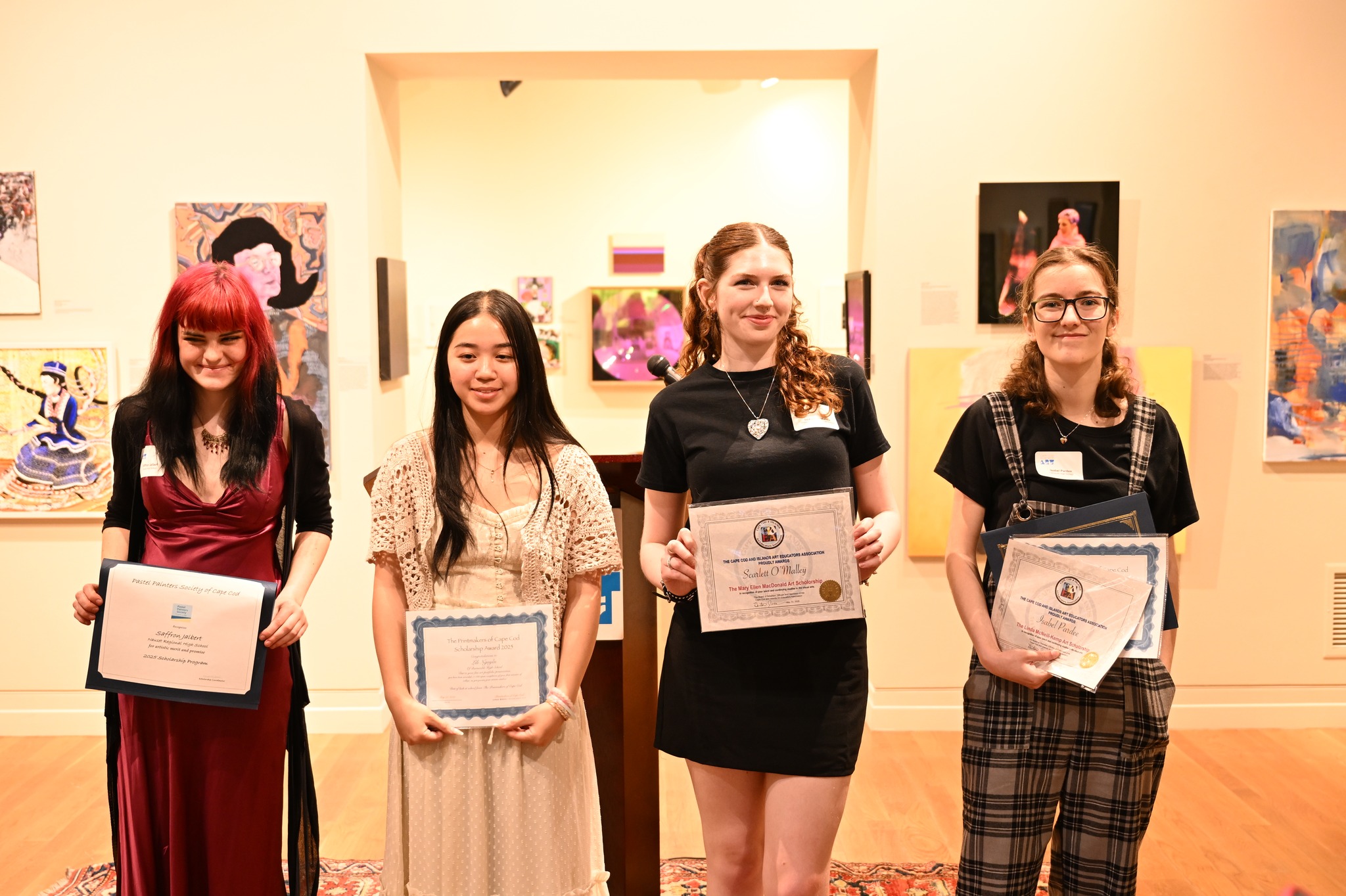 Graduating seniors Saffron Jalbert, Lili Nguyen, Scarlett O'Malley, and Isabel Pardee at the scholarship ceremony in May at the Cape Cod Museum of Art for students pursuing degrees in the arts.